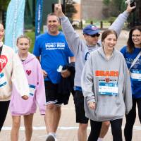 A family celebrates finishing the course